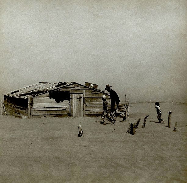 Farmer and sons walking in the face of a dust storm. Cimarron County, Oklahoma, USA April 1936